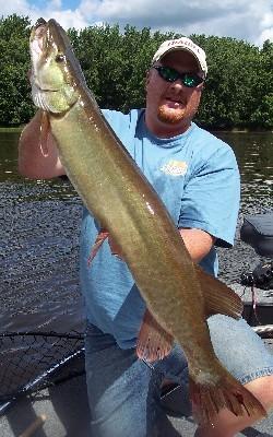 Guide Joel DeBoer shows off a musky that ate a Mepps Bucktail