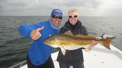 Capt. John says thumbs up to Christy's big red.