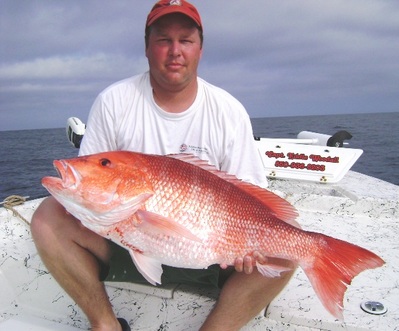 Scott with a 20 pound Red Snapper caught with Capt. Eddie Woodall and Full Net Fishing Charters