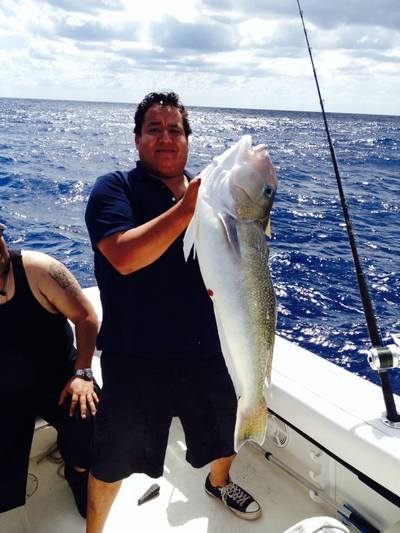 Captain holding a really big golden tilefish just brought up from the deep