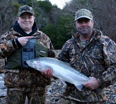 Johnny and Rich Ariza holds a large Chetco River hatchery steelhead caught Feb. 8 with guide Andy Martin of Wild Rivers Fishing in Brookings. The fish hit a pink Puff Ball and small cluster of roe cured in Pautzke's BorxOFire. Photo by Andy Martin