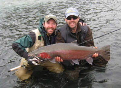 Photo of the Week: SEASONS PAST: Gill McKean holds his clients Steelhead caught on a Skeena tributary. Gill is the owner of Westcoast Fishing Adventures.  He guides the