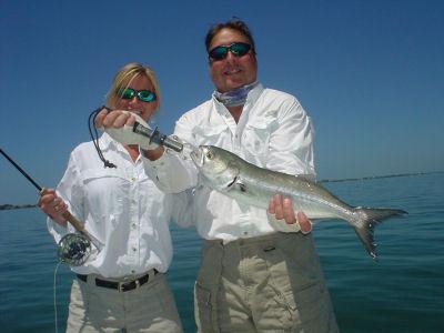 Bill and Sandy King, from Osprey, FL, with a nice bluefish caught and released with a fly while fishing Sarasota Bay with Capt. Rick Grassett.
