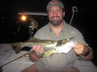 Bill Fox, from GA, with a snook caught and released on a fly while fishing dock lights in Sarasota Bay with Capt. Rick Grassett.