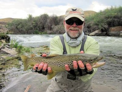 Capt. Rick Grassett with a Beaverhead River brown trout caught and released on a fly while fishing with guide Tom Caffrey out of Crane Meadow Lodge, MT.
