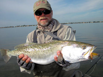 Capt. Rick Grassett waded a Sarasota Bay sand bar and caught and released this 6-lb trout on his Grassett Flats Minnow fly.