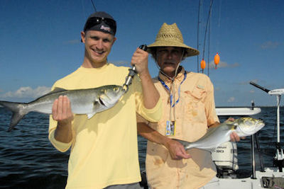 Steve and Chris Partain's Sarasota bluefish double caught with Capt. Rick Grassett.