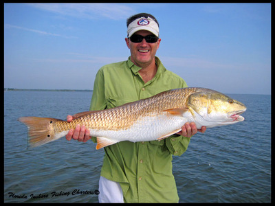Kelly from Japan with a nice Mosquito Lagoon Redfish