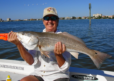 Kate with a whopper low tide red caught with Capt. C.A. Richardson