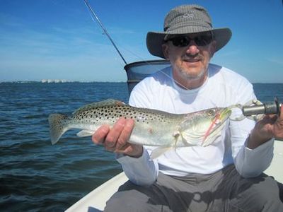 Dirk Crews, from WI, with a trout caught and released on an Ultra Hair Clouser fly while fishing Sarasota Bay with Capt. Rick Grassett.