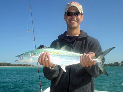 Eric Watson, from St. Petersburg, FL, with a nice spanish mackerel caught and releasedin Sarasota's Big Pass while fishing with Capt. Rick Grassett.