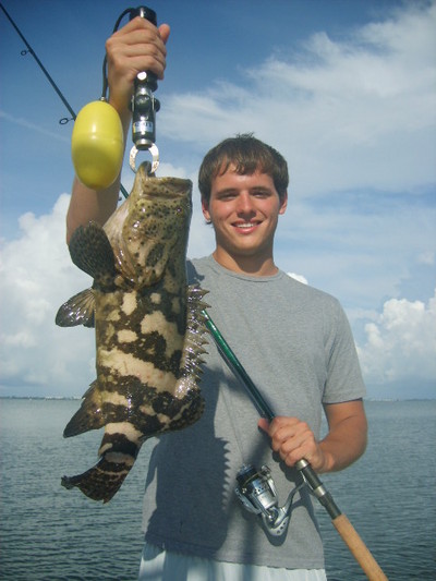 Robby with a goliath grouper