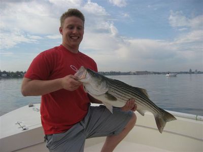 Ryan Nails his first Striper aboard Reel Therapy