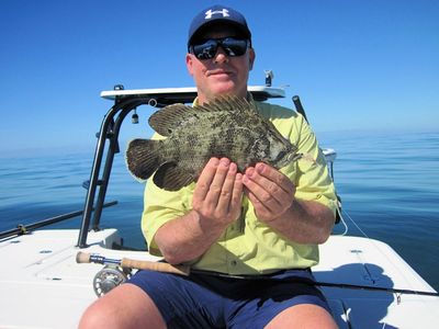 Kirk Grassett, from Middletown, DE, caught and released this tripletail on a fly while fishing the coastal gulf in Sarasota with Capt. Rick Grassett