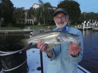 Steve Cohn, from Australia, with a nice snook caught and released on a fly while fishing Sarasota Bay with Capt. Rick Grassett.