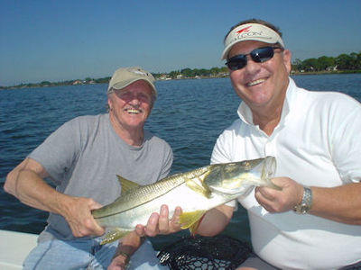 Jerry Clapp, from IN, and Gary Burbank (a.k.a. Earl Pitts), from OH, with a nice snook caught in Sarasota Bay with Capt. Rick Grassett.