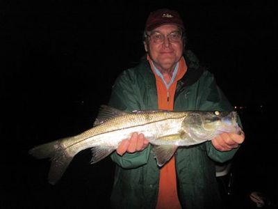 Jerry Poslusny, from Palmetto, FL, with a snook caught and released on a Grassett Snook Minnow fly while fishing the ICW at night near Venice, FL.