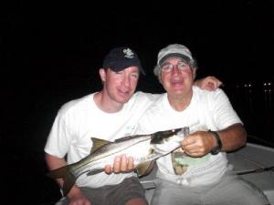 Jim Festa, from Sarasota, FL, with his sone, Gerry Festa from San Jose, CA with one of eight snook that they caught and released on DOA lures while fishing with Capt. Rick Grassett.