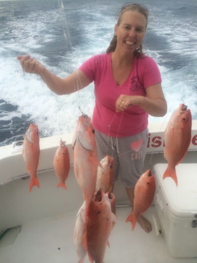 Katie with a bunch of snappers