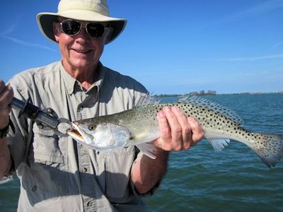 Keith McClintock, from Lake Forest, IL, with a nice trout caught on a CAL hig with a shad tail while fishing Gasparilla Sound with Capt. Rick Grassett