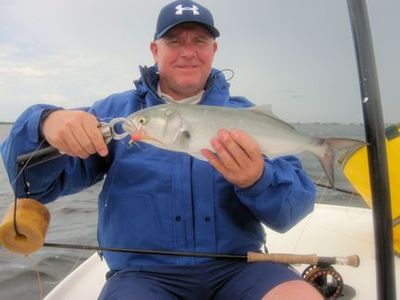 Kirk Grassett, from Middletown, DE, with a bluefish caught and released on a fly in Sarasota Bay while fishing with Capt. Rick Grassett.