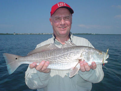 Kirk Grassett caught this red on a Clouser fly while fishing Sarasota Bay with Capt. Rick Grassett.