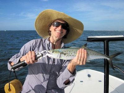Lindsey Lewis, from CO, with a Spanish mackerel caught and released on an Ultra Hair Clouser fly while fishing Sarasota Bay with Capt. Rick Grassett.
