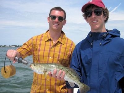 Austin Bitta & Shane Reilly, from Libertyville, IL, with a nice Sarasota Bay trout caught on a DOA Deadly combo while fishing with Capt. Rick Grassett.