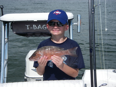 A happy young man with a snapper