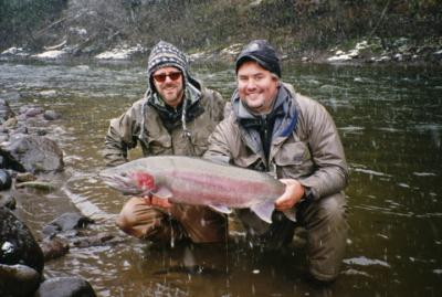 The photo of the week shows a very nice Skeena River tributary Steelhead held briefly by Dustin Kovacvich.  We won�t talk about the weather:-(.  Jeff Bright landed the fish with a fly called �Little Elvis�.  It was the last day of the Nicholas Dean