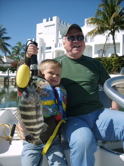 Grandpa taking grandson fishing for sheepshead