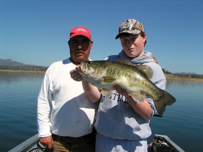 Daniel Owen shows off a bass he caught while fishing with Anglers Inn  at Lake El Salto, Mexico.