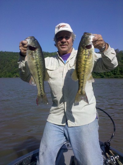 The author with a couple of big, Alabama winter spotted bass caught in shallow water!