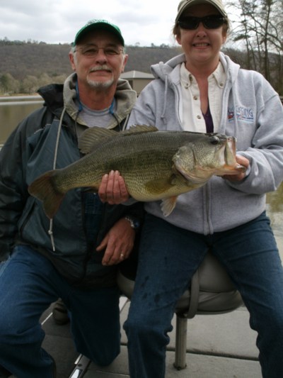 A nice couple of bass anglers with an 11 pound bass!