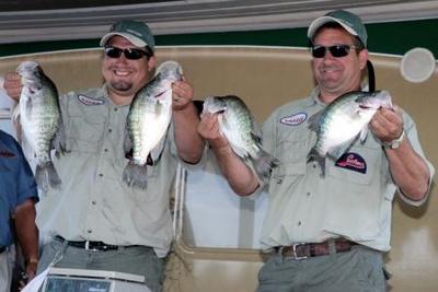 Duffy and Brian Cleland of Decatur, Ill., show off some of the fish they caught to win the Amateur Division of the 2009 Cabelas Crappie USA Classic, held on the Tennessee-Tombigbee Waterway near Columbus, Miss.  (Photo by John N. Felsher)