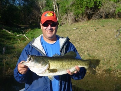 Carl P. Hochrein shows off the 9.5-pound bass he caught with Anglers Inn at Lake El Salto.