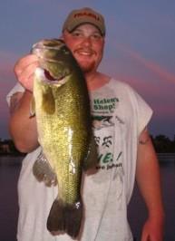 Guide Joel DeBoer shows a nice Central Wisconsin largemouth that was buried in the slop