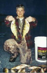 Jesse Chellevold displays a great catch of yellow perch