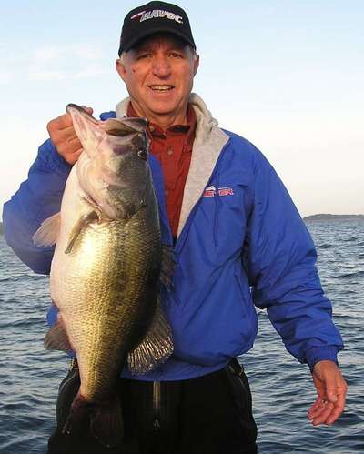Verticle jigging a spoon gets results as the author lands this 10 lb 13 oz monstor that hit in 37 feet on south Toledo Bend\'s Indian Creek.