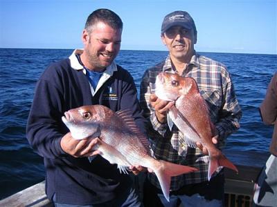 Captain Glenn with his client with a couple of snapper