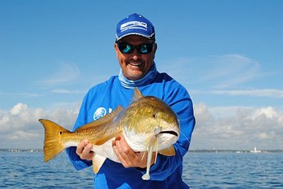 Capt. John Rivers with a Golden Pensacola Bay Redfish.