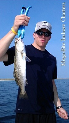 Adam is all smiles after landing this nice trout
