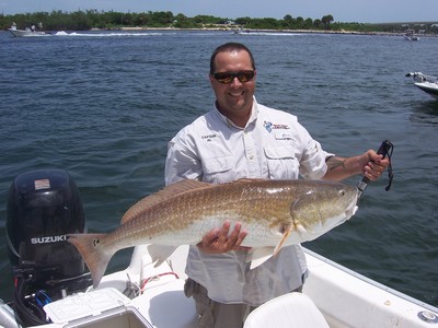 Captain Al with the biggest Redfish of the day, more than 60inches.