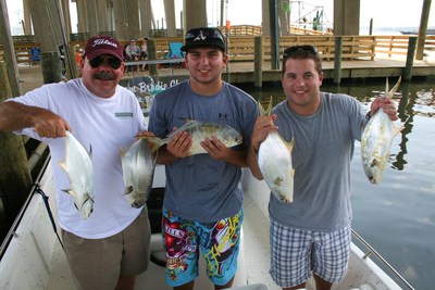 Ray Starrett and sons with some of their Florida pompano caught aboard TEAM BRODIE CHARTERS.