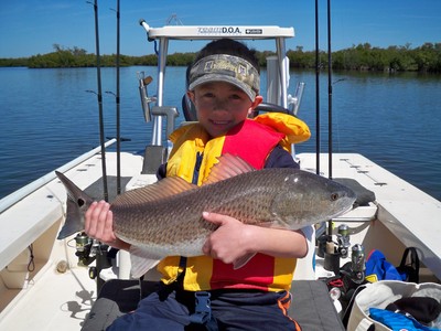 Seven year old Jack Hannum with his first redfish!