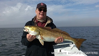 Brian is all smiles after landing this big redfish