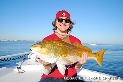 My son Nick is all smiles after landing this monster red!