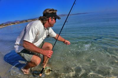 Glen Tremble, from San Diego, releases his first small jack on the fly.[/