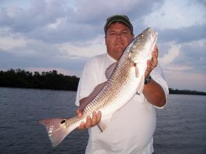 Gary Graves holding a nice slot size redfish....