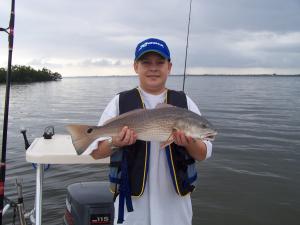 Dillon with his redfish caught along the flats...